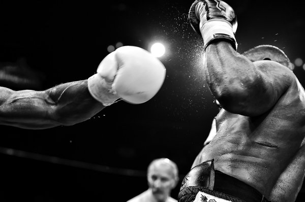How should a boxer's training regimen be altered when preparing for a higher weight class?